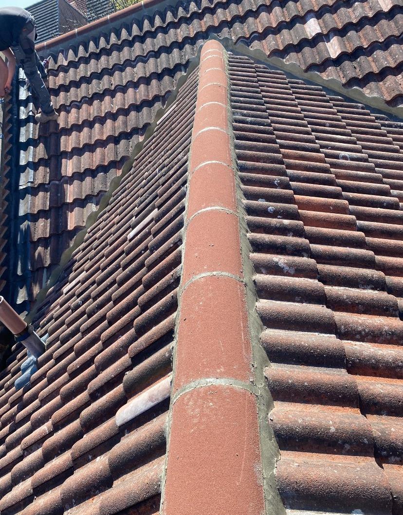 Ridge Tile Detail Work - Leeds - Close-up of professional ridge tile pointing and bedding.
