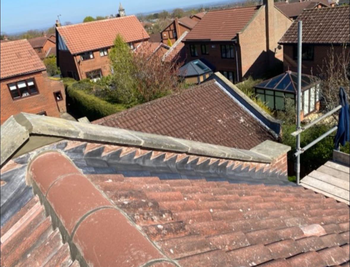 Ridge tiles and lead valley flashing on a Harrogate roofing project by APR Roofing
