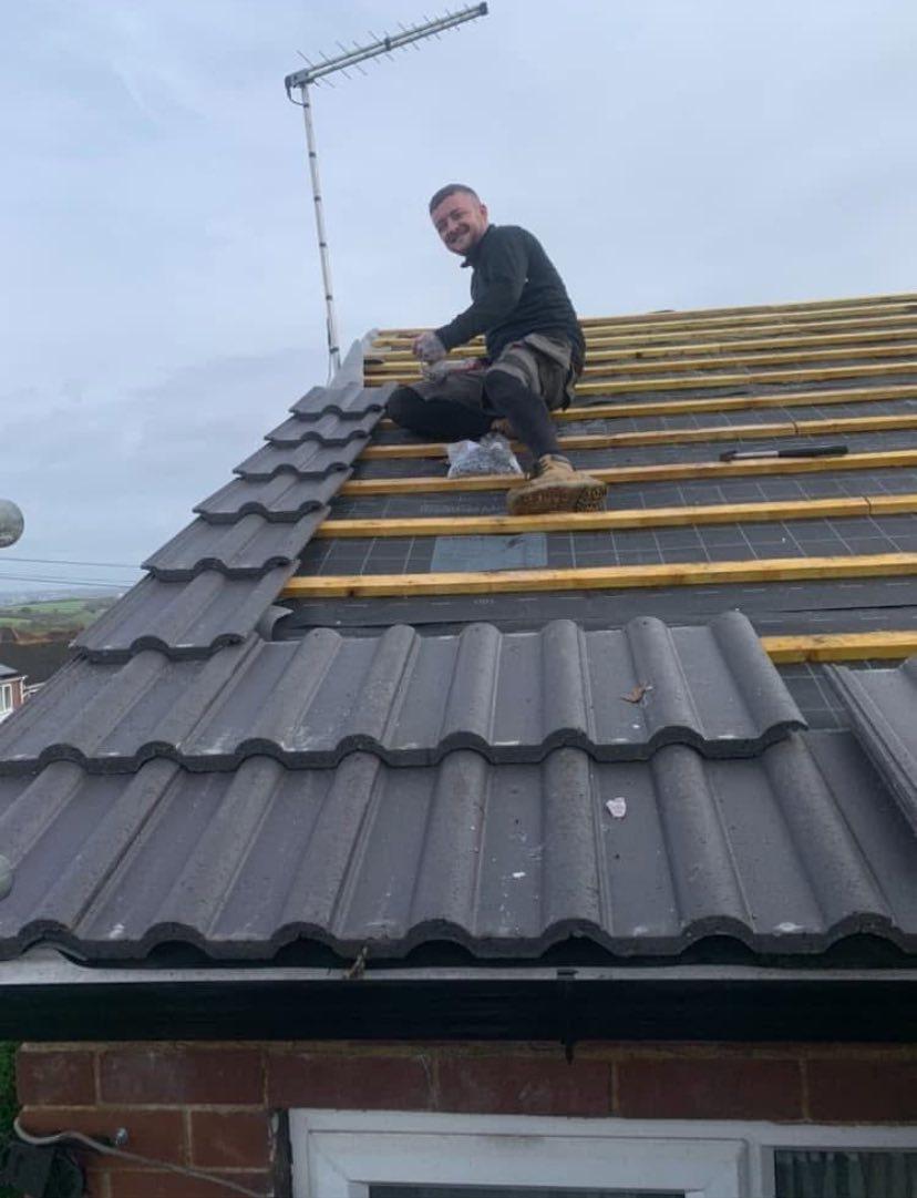 Roof Tiling In Progress - Yorkshire - New tile installation showing our team's expert craftsmanship.